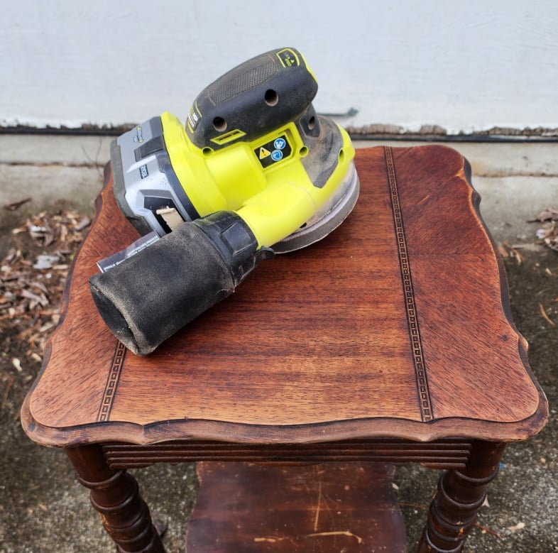 orbital sander to smooth tabletop after stripping