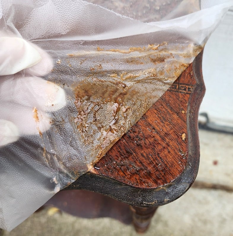 peeling plastic wrap from citristrip tabletop