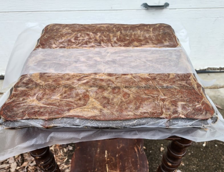 plastic wrap covering citristrip on the tabletop