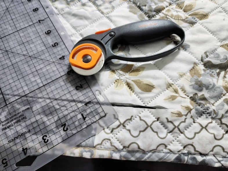 rotary cutter with a mat and a quilt
