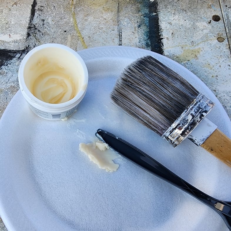 apply furniture wax with brush
