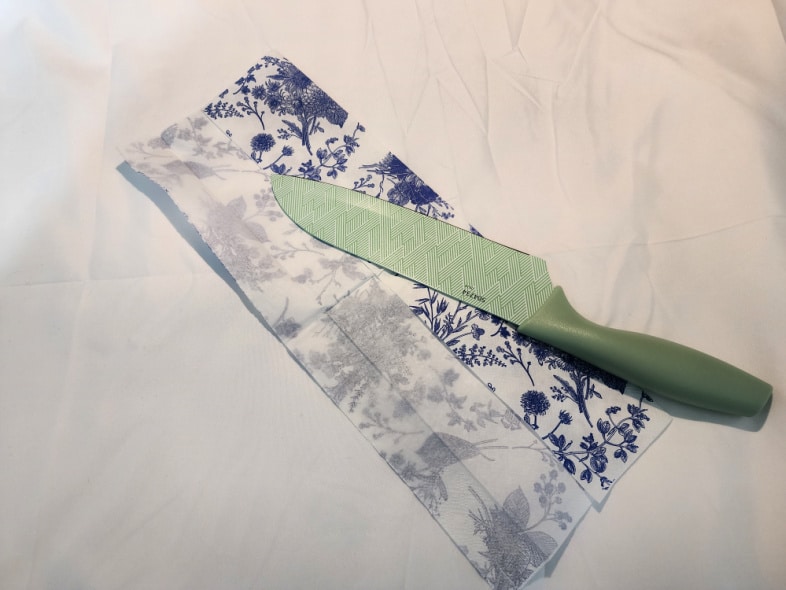 kitchen knife cuts strips of napkins for decoupage