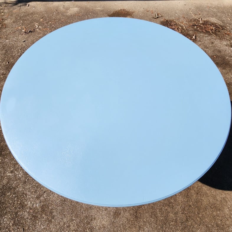 second coat of blue paint on table top