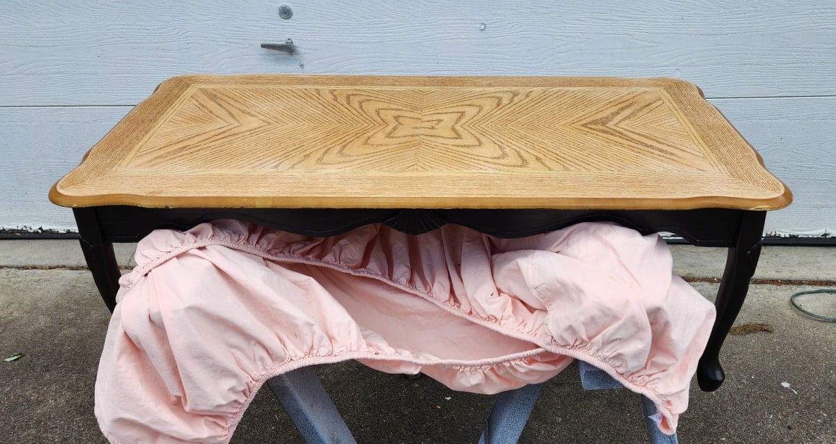 french provincial coffee table with natural top and black base