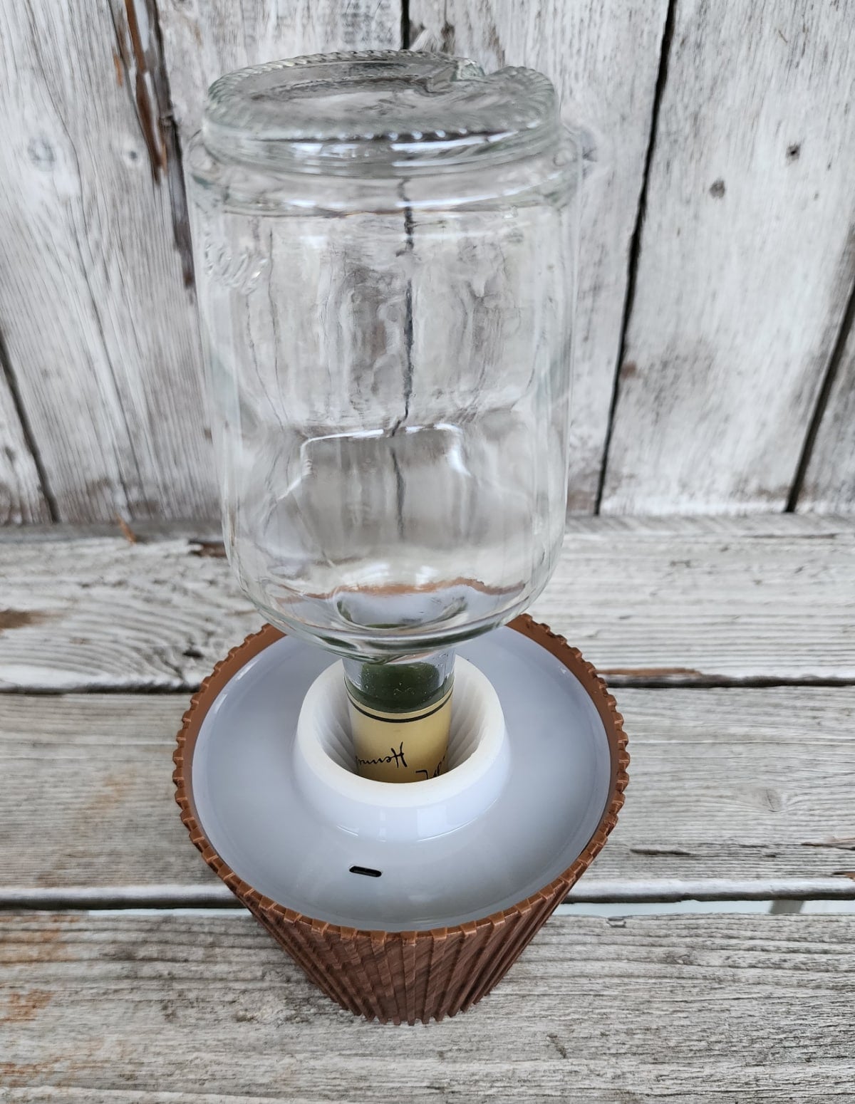hennessy bottle upside down in a wireless lamp shade