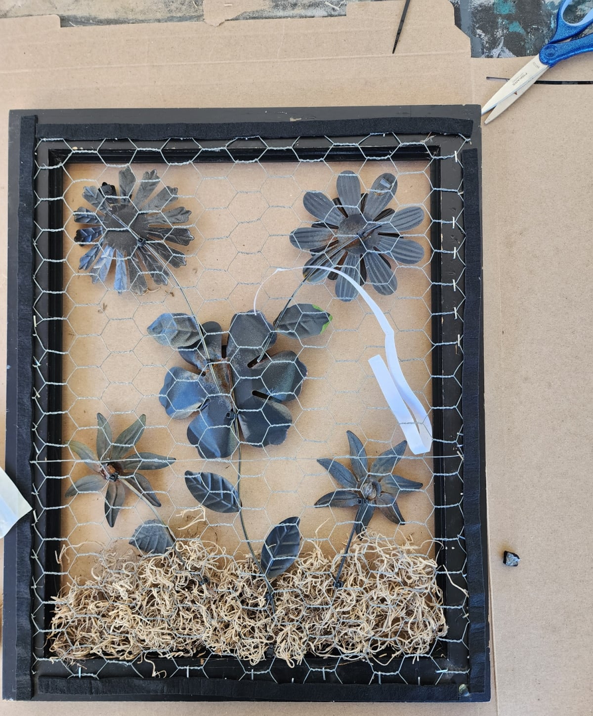 felt tape backing placed over sharp chicken wire pieces
