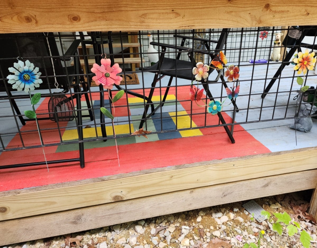 metal garden flowers hanging on the deck