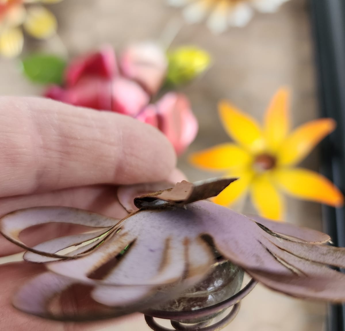 small metal flowers with metal clip on the back