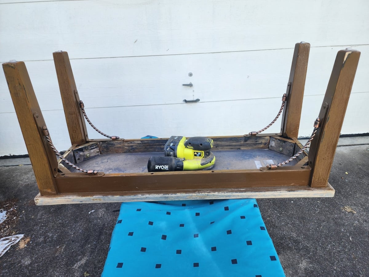 sand underside of thrift store bench