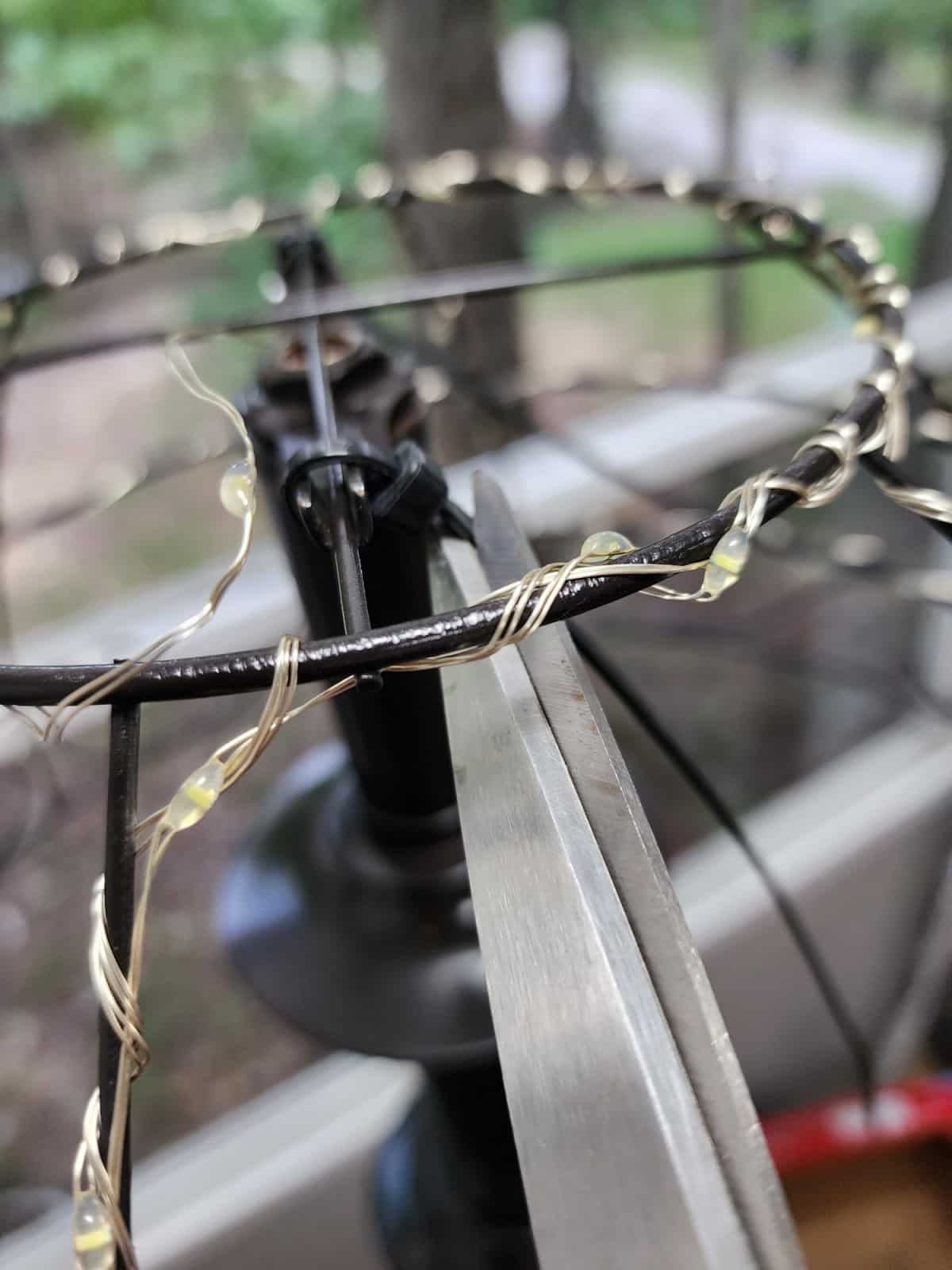 closeup of wire wrapping and snipping the zip tie tail