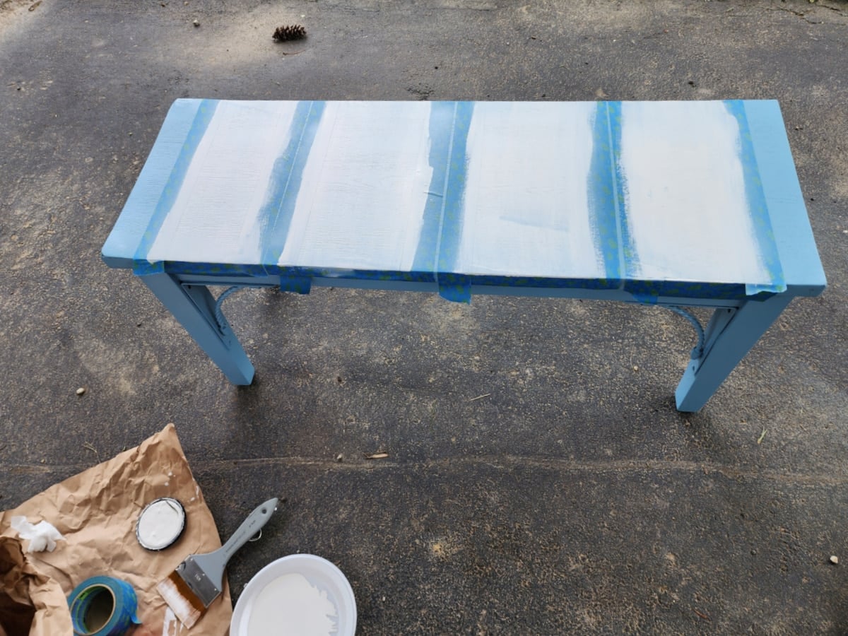 first coat of light gray paint stripe
