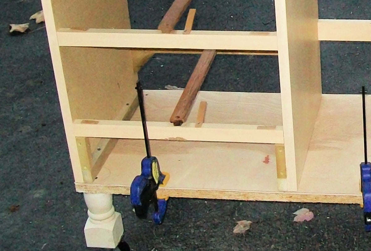 close-up of securing desk to the bottom board