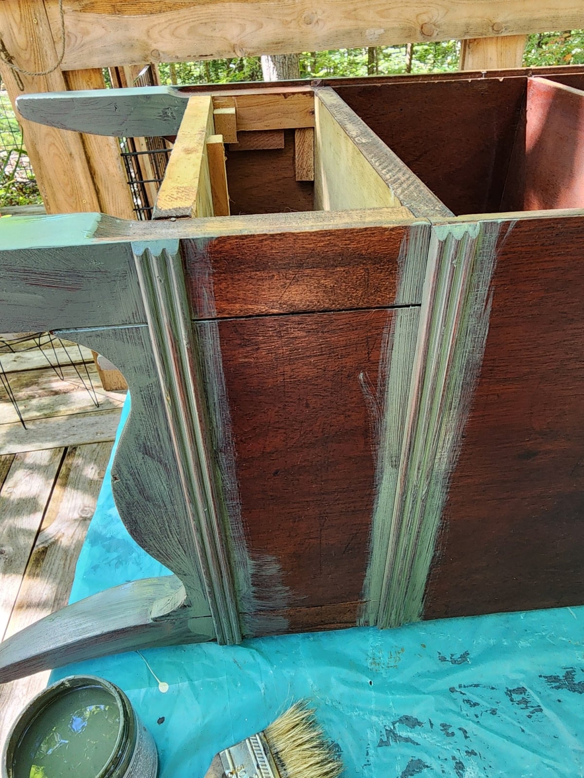paint trim on the side of the wooden phone stand cabinet