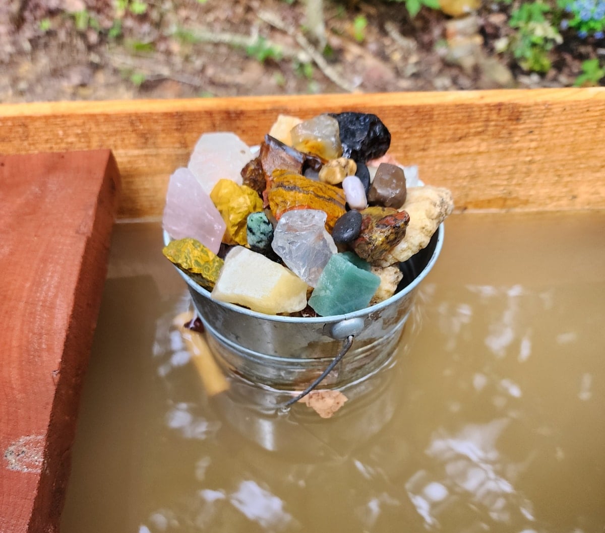 bucket full of rocks and gems