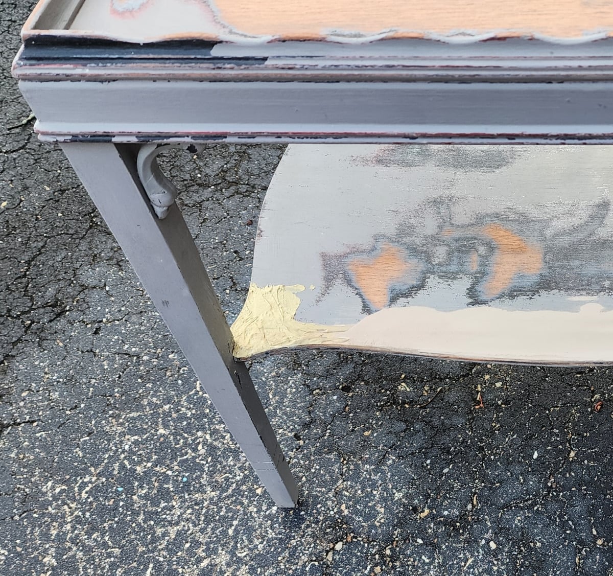 bondo repair on a table shelf