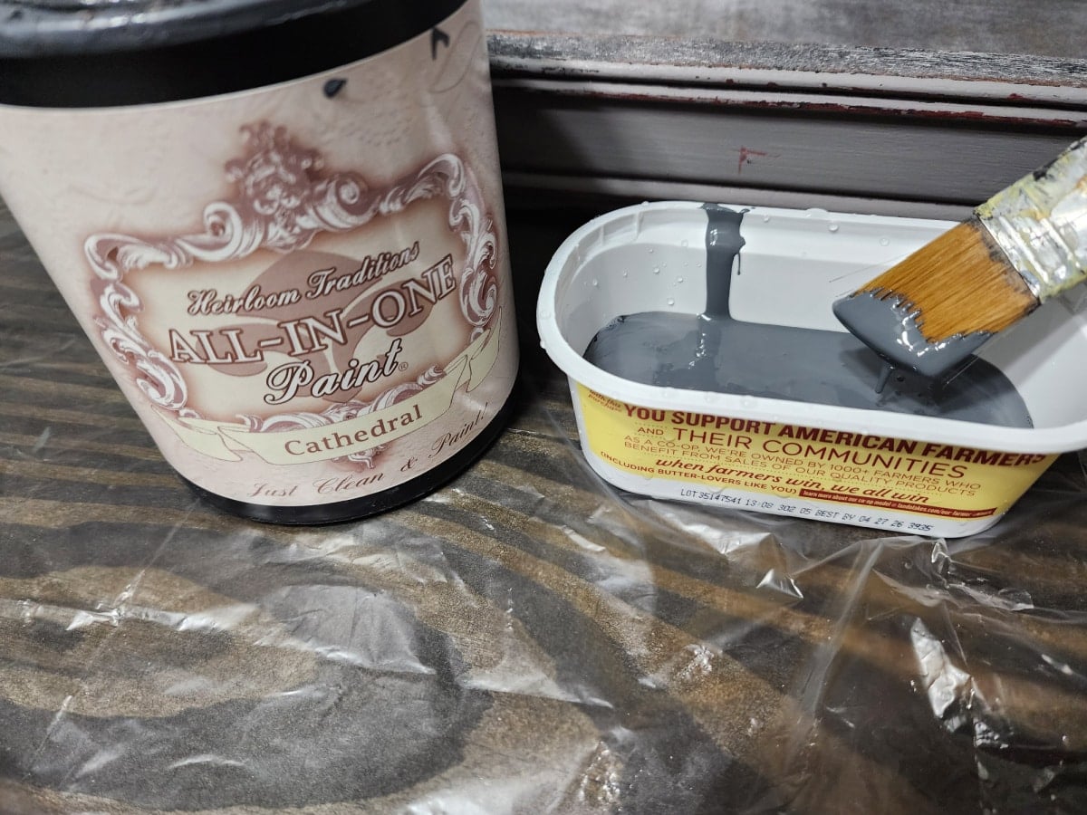 cathedral dark gray paint using a small angle paint brush
