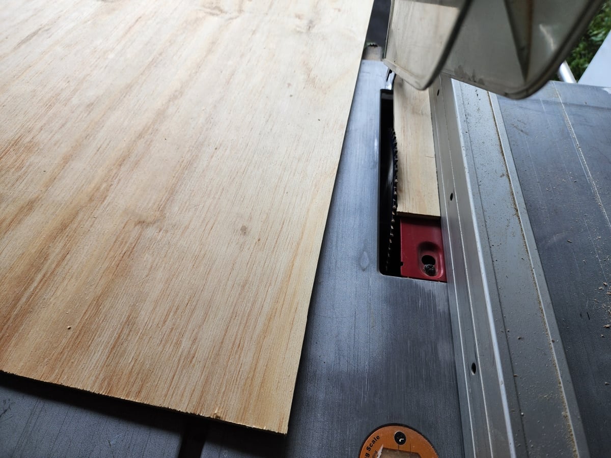 cutting a new plywood table top on the table saw