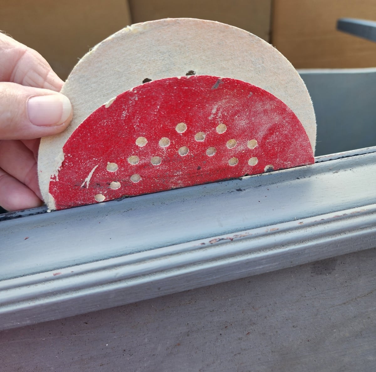 folded sandpaper in table grooves