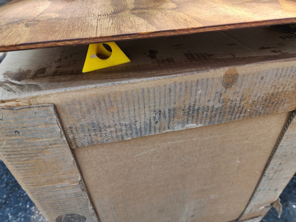 paint triangles holding stained plywood