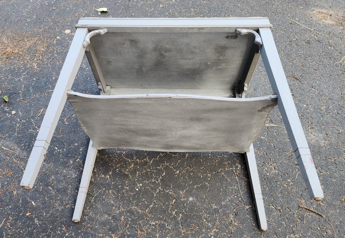 underside of vintage gray side table